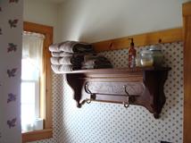 Chocolate room private bath towel shelf